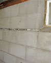 Severely buckling foundation walls in a home in Hoboken, NJ in need of repairs.