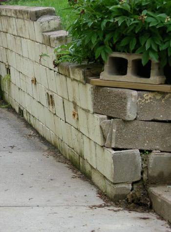 collapsing retaining wall with severe damage in East Brunswick, NJ