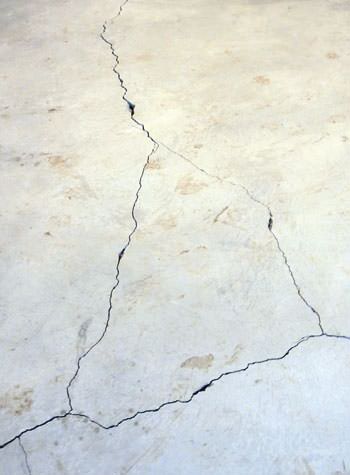 severely cracked, heaving slab floors in a home in Hackensack, NJ