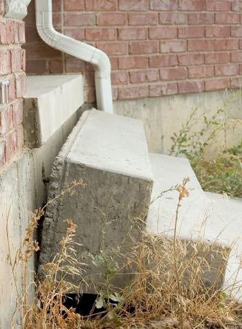 sinking outdoor concrete steps showing cracking and soil washout in Plainfield, NJ