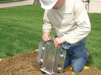 Fastening an earth anchor for a severely bowing wall in Passaic.