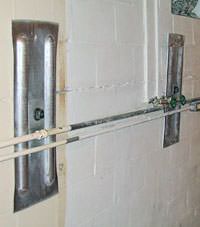 A foundation wall anchor system used to repair a basement wall in East Brunswick, NJ