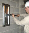 Tightening a wall anchor plate in Edison, New Jersey