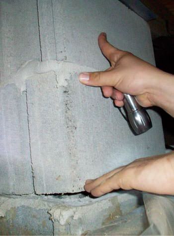 a completely failing concrete crawl space support pillar in Kearney, NJ