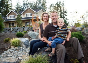 A happy family outside a home with a repaired foundation in Hackensack, NJ
